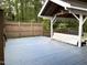 This outdoor deck features a covered shelter, with scenic, natural views and a blue painted floor at 4220 Hope Valley Road Rd, Durham, NC 27707