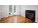Dining area with hardwood floors, fireplace and french doors leading to outdoor scenery at 4220 Hope Valley Road Rd, Durham, NC 27707