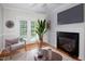 Dining area with fireplace, french doors, and comfortable seating at 4220 Hope Valley Road Rd, Durham, NC 27707