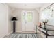Charming entryway features decorative glass door, stylish console table, and modern rug, creating a welcoming ambiance at 4220 Hope Valley Road Rd, Durham, NC 27707