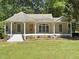 Charming one-story home with a welcoming front porch and well-manicured lawn at 4220 Hope Valley Road Rd, Durham, NC 27707