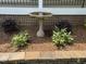 Landscaping with a birdbath and decorative bushes in the front yard at 4220 Hope Valley Road Rd, Durham, NC 27707