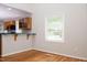 Kitchenette area with a window for natural light and hardwood floors at 4220 Hope Valley Road Rd, Durham, NC 27707