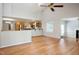 Bright living room with hardwood floors, vaulted ceiling, and open layout to the kitchen at 4220 Hope Valley Road Rd, Durham, NC 27707
