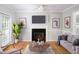 Inviting living room with a fireplace, comfortable seating, and modern decor at 4220 Hope Valley Road Rd, Durham, NC 27707