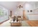 Stylishly decorated living room with a comfortable sofa, coffee table, and a large window at 4220 Hope Valley Road Rd, Durham, NC 27707