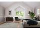 Inviting bedroom with vaulted ceiling, soft decor, and a view of the outdoors at 4220 Hope Valley Road Rd, Durham, NC 27707
