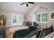 Comfortable bedroom featuring high ceilings, double doors, and a ceiling fan at 4220 Hope Valley Road Rd, Durham, NC 27707