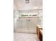 Large tiled shower with glass enclosure, multiple shower heads, and a built-in bench at 4220 Hope Valley Road Rd, Durham, NC 27707