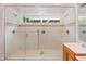 Large tiled shower with glass enclosure, multiple shower heads, and a built-in bench at 4220 Hope Valley Road Rd, Durham, NC 27707