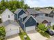 A high angle view of navy-blue homes with garages and concrete driveways, nestled in a neighborhood at 450 Granite Mill Blvd, Chapel Hill, NC 27516