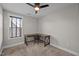 Bedroom showcasing a ceiling fan, neutral paint, and an office desk and chair at 450 Granite Mill Blvd, Chapel Hill, NC 27516