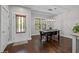 Dining room featuring hardwood floors, modern lighting, a dining table with seating for six, and large windows at 450 Granite Mill Blvd, Chapel Hill, NC 27516