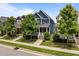 Charming two-story home with blue siding, a red front door, a cozy front porch and landscaped front yard at 450 Granite Mill Blvd, Chapel Hill, NC 27516
