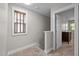 Upstairs hallway with carpeted floors, window with wood blinds, and access to bedrooms at 450 Granite Mill Blvd, Chapel Hill, NC 27516