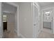 Hallway with white trim, carpet, and a laundry closet at 450 Granite Mill Blvd, Chapel Hill, NC 27516
