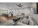 Open-concept living room featuring a cozy seating area and connected to a modern kitchen at 450 Granite Mill Blvd, Chapel Hill, NC 27516