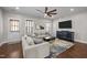 Relaxing living room with large windows, modern furniture, and stylish decor at 450 Granite Mill Blvd, Chapel Hill, NC 27516