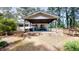 Exterior of house showcasing backyard with lawn and covered area at 4509 Stevens Chapel Rd, Smithfield, NC 27577