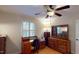 Bedroom with hardwood floors, ceiling fan, desk, and dresser at 4509 Stevens Chapel Rd, Smithfield, NC 27577