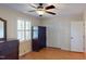 Cozy bedroom featuring hardwood floors, a ceiling fan, and a closet for ample storage at 4509 Stevens Chapel Rd, Smithfield, NC 27577