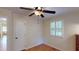 Bedroom with hardwood floors, ceiling fan, and window at 4509 Stevens Chapel Rd, Smithfield, NC 27577