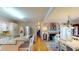 Bright kitchen boasts granite counters, stainless steel appliances, and an open floor plan to the living area at 4509 Stevens Chapel Rd, Smithfield, NC 27577