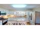 Bright kitchen with granite countertops, an island, and stainless steel appliances at 4509 Stevens Chapel Rd, Smithfield, NC 27577