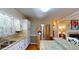 Well-lit kitchen featuring granite countertops, stainless steel appliances, and ample cabinet space at 4509 Stevens Chapel Rd, Smithfield, NC 27577