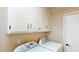 Functional laundry room with side-by-side washer and dryer, offering convenience and efficiency for laundry needs at 4509 Stevens Chapel Rd, Smithfield, NC 27577