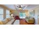 Cozy living room with neutral tones, plush seating, and access to the outdoor patio space at 4509 Stevens Chapel Rd, Smithfield, NC 27577