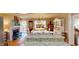 Open-concept living and dining space with a kitchen island and access to the outdoor area at 4509 Stevens Chapel Rd, Smithfield, NC 27577