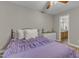 Comfortable bedroom with hardwood floors, dresser, and a view of the bathroom at 501 Gooseneck Dr # B2, Cary, NC 27513