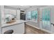 Bright kitchen featuring white cabinetry, quartz countertops, and stainless steel appliances at 501 Gooseneck Dr # B2, Cary, NC 27513