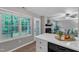 Bright kitchen with a breakfast bar, backyard view and a pass-through to the living room at 501 Gooseneck Dr # B2, Cary, NC 27513