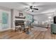 Open living space with fireplace, ceiling fan, dining area, and plenty of natural light at 501 Gooseneck Dr # B2, Cary, NC 27513