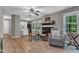 Bright living area flows to kitchen and features fireplace, dining space and hardwood floors at 501 Gooseneck Dr # B2, Cary, NC 27513