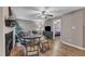 Cozy living and dining area with fireplace, ceiling fan, and view to bedroom at 501 Gooseneck Dr # B2, Cary, NC 27513
