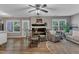Inviting living space featuring fireplace, ceiling fan, hardwood floors, and neutral decor at 501 Gooseneck Dr # B2, Cary, NC 27513