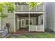 View of covered patio, with fenced in lawn and access to lower-level apartment at 501 Gooseneck Dr # B2, Cary, NC 27513