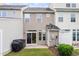 The backyard patio features a sliding door, grill, small patch of grass, and privacy fence at 510 Berry Chase Way, Cary, NC 27519