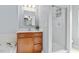 Bright bathroom showcasing a glass-enclosed shower, soaking tub, vanity, and neutral walls at 510 Berry Chase Way, Cary, NC 27519