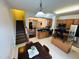 Open concept kitchen with an eat in table, kitchen island with dark countertop, and dark appliances at 510 Berry Chase Way, Cary, NC 27519
