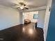 Open living room with dark hardwood floors, neutral walls and an open view to the dining and living spaces at 510 Berry Chase Way, Cary, NC 27519