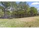 Scenic pond surrounded by mature trees and featuring a serene bench for peaceful contemplation at 510 Berry Chase Way, Cary, NC 27519