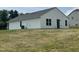 Back exterior of a one-story home with windows and sliding glass door at 5219 Merlin Dr, Snow Camp, NC 27349