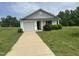 Charming one-story home with inviting front yard and driveway at 5219 Merlin Dr, Snow Camp, NC 27349