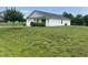Well maintained house sits on large lot with mature tree on the property at 5219 Merlin Dr, Snow Camp, NC 27349