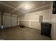 Spacious unfinished two car garage with white walls at 5219 Merlin Dr, Snow Camp, NC 27349