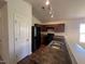 Open kitchen featuring modern appliances and an eat-in bar with a stainless steel sink at 5219 Merlin Dr, Snow Camp, NC 27349
